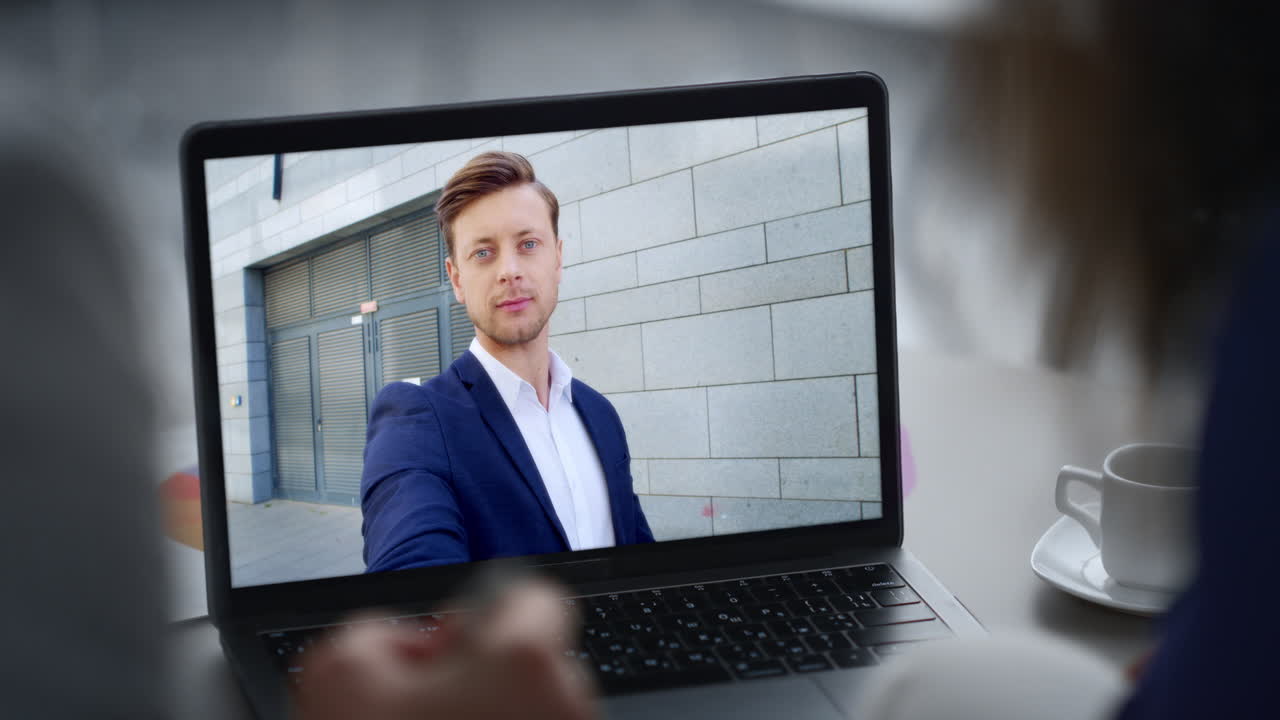 Smiling manager have video call with two unknown clients by laptop close up