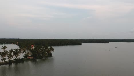 beautiful aerial shot of a backwater,shore of vembanad lake, canal, sunset