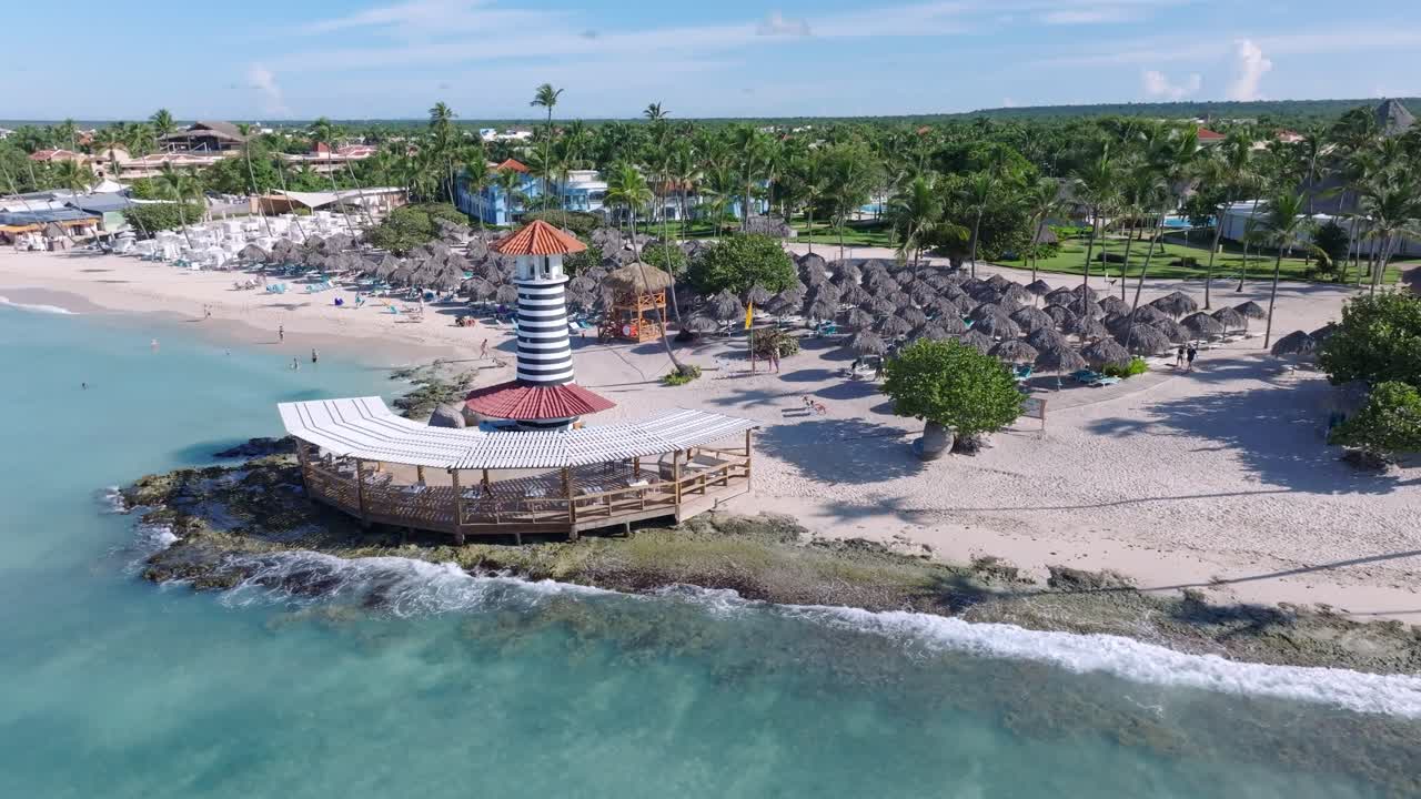 Aerial View of a Tropical Beach Resort with Lighthouse