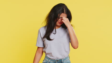 exhausted tired indian woman takes off glasses, rubbing eyes feels pain, sleepy exhausted, overwork