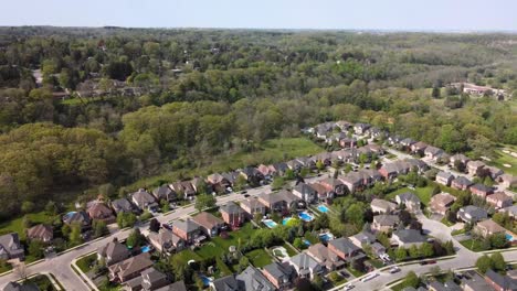 Aerial-shot-orbiting-over-sunny,-summer-Hamilton-neighborhood