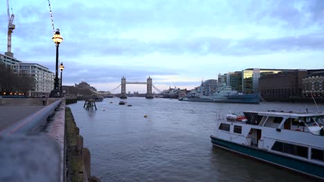 4k landscape view of london thames river with london tower bridge in the background.