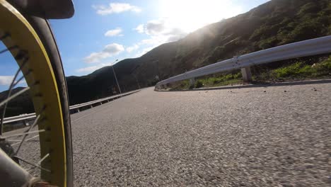 point of view riding along open empty roads in ninh thuan, vietnam north of vin hy