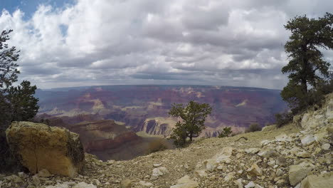 a time lapse shot of the clouds moving across the vast sky of the grand canyon of arizona