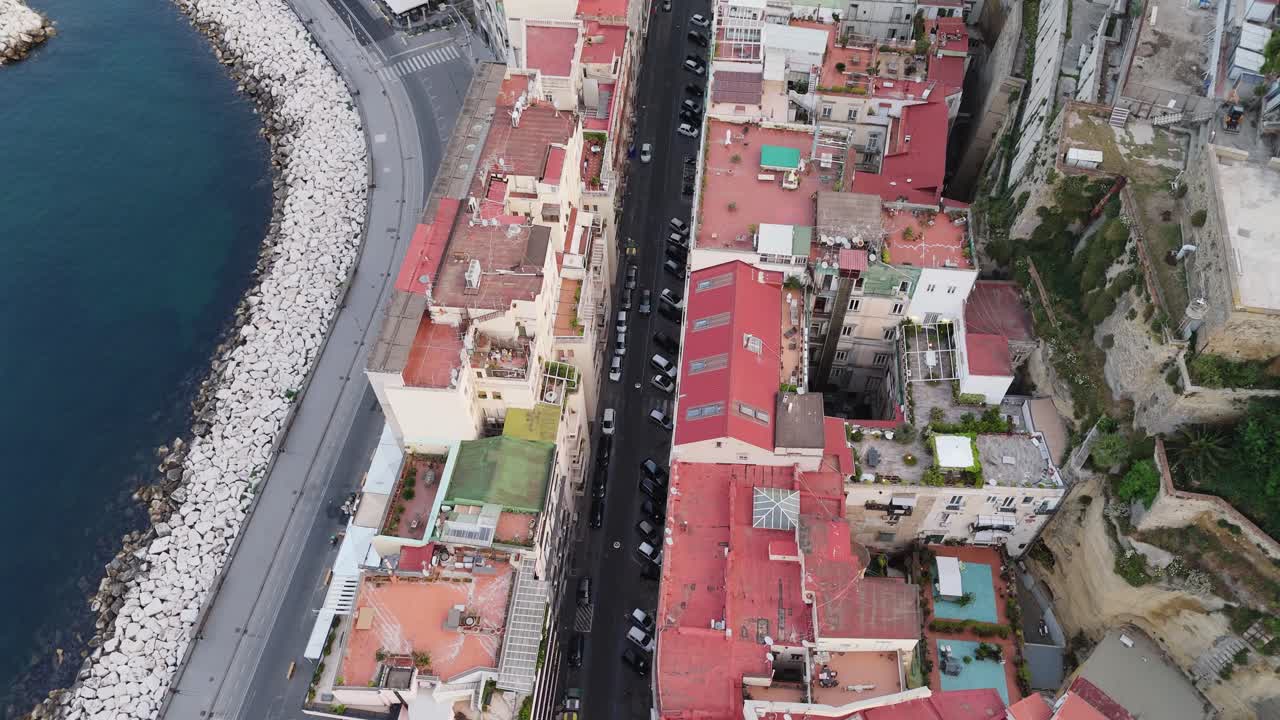 drone aerial top down Naples south italy cityscape with traffic narrowed road car traffic driving In the city center