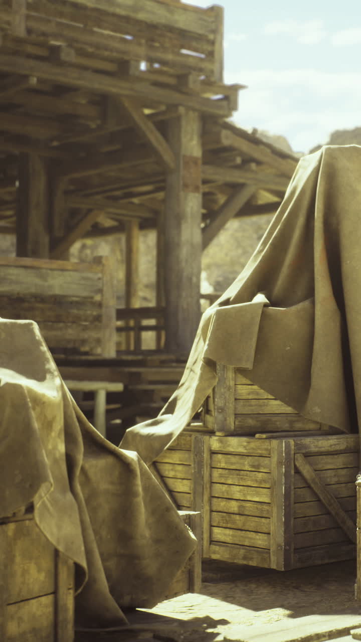 Hidden treasures wrapped in cloth at a rustic wooden barn under bright sky