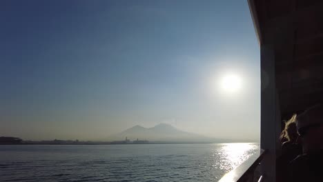 looking at islands off coast of naples in a ferry in italy - pov