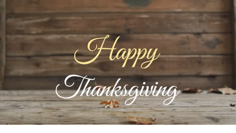animation of happy thanksgiving text over autumn leaves falling on wooden background
