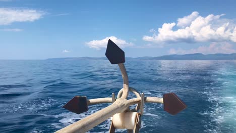 closeup of large iron drop anchor at the back of sailing ship in 4k in sithonia on mediterranean sea