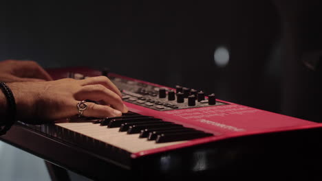 person playing a red keyboard