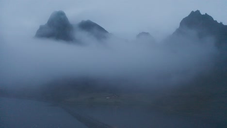 car driving in the road on a foggy weather near the eystrahorn mountain in east iceland