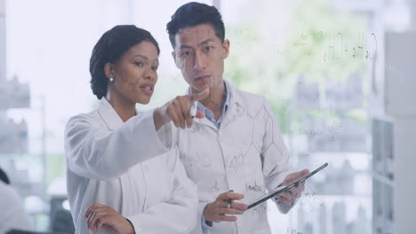 two scientists using a digital tablet