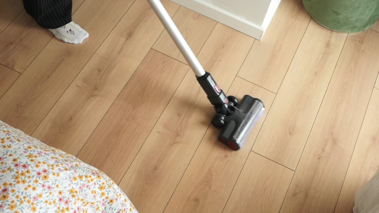 Vacuuming a hardwood floor