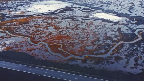 Snowy-valley-with-road-in-highlands