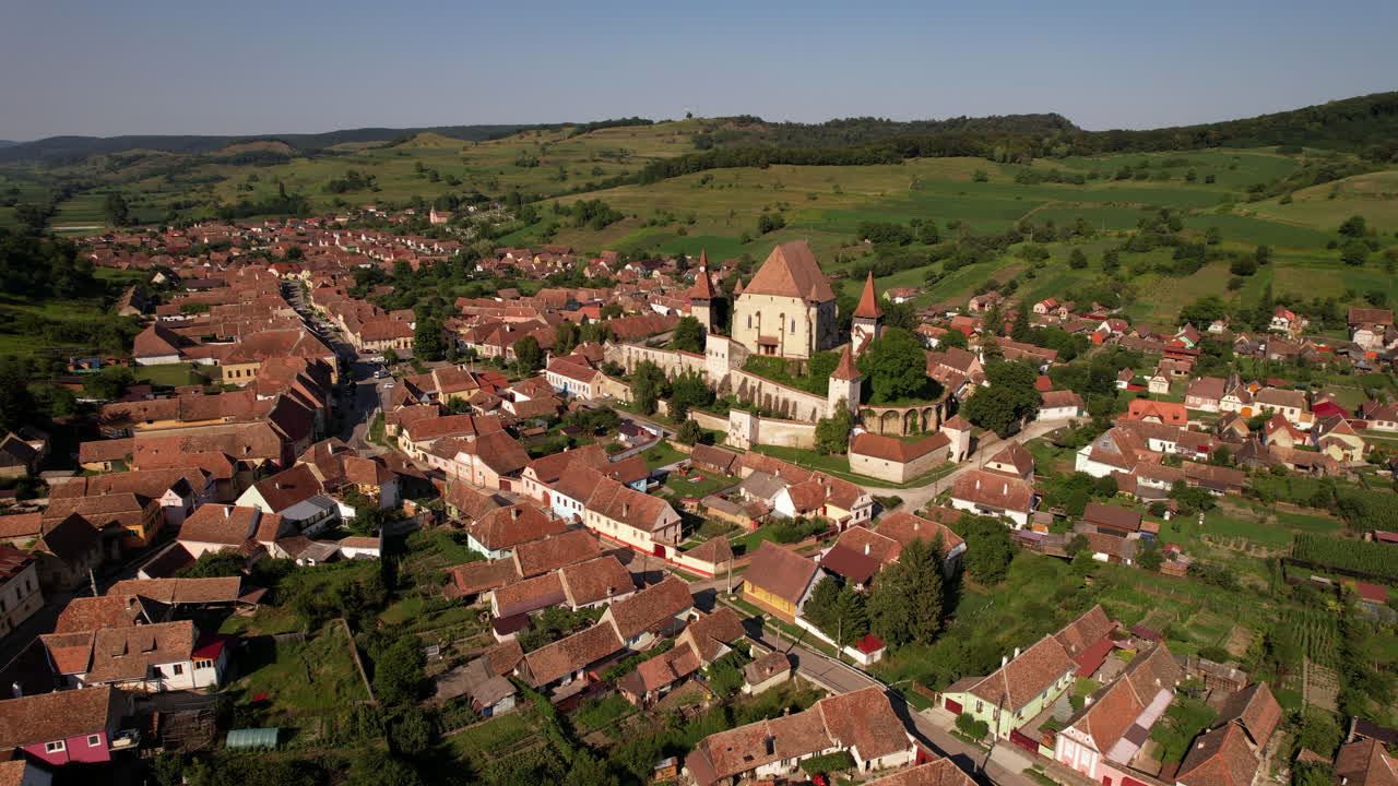 Fortified castle church in remote village of Transylvania. Aerial