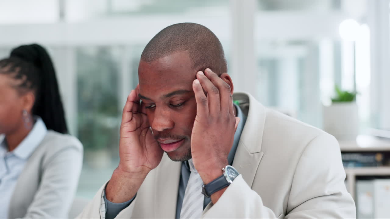 Stress, headache and businessman in the office