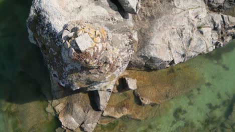 Topdown-View-Of-Massive-Rock-Cliffs-On-The-Coast-Near-Aldan-In-Galicia,-Spain