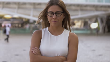 Girl-in-eyeglasses-smiling-at-camera-outdoor