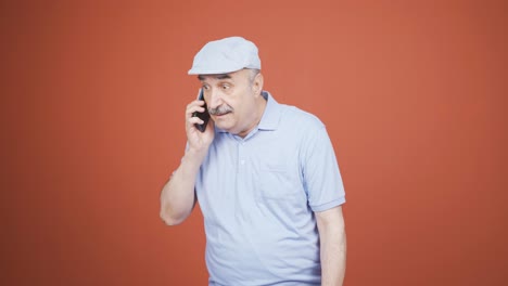 Old-man-receiving-gospel-on-the-phone.