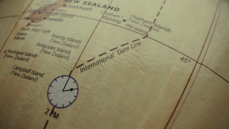 close-up of a world globe map, focusing on the international date line and new zealand
