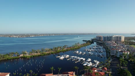 slow and cinematic drone aerial view over condos and boats in florida community