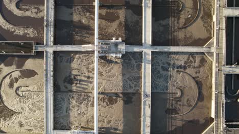 aerial top-down detail of the working aeration basin in a sewage treatment plant