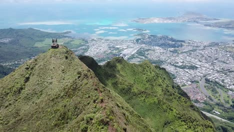 drone 4000ft up in the air in oahu getting a shot of the mountain top trail of the stairway to heaven, revealing a new perspective of the mountains