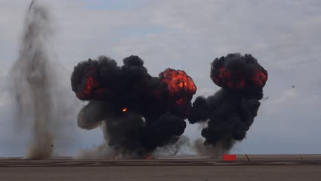 explosion on a beach black smoke uk 4k