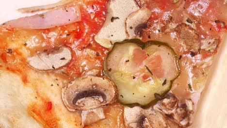 pizza top view. rotating a slice of pizza close-up