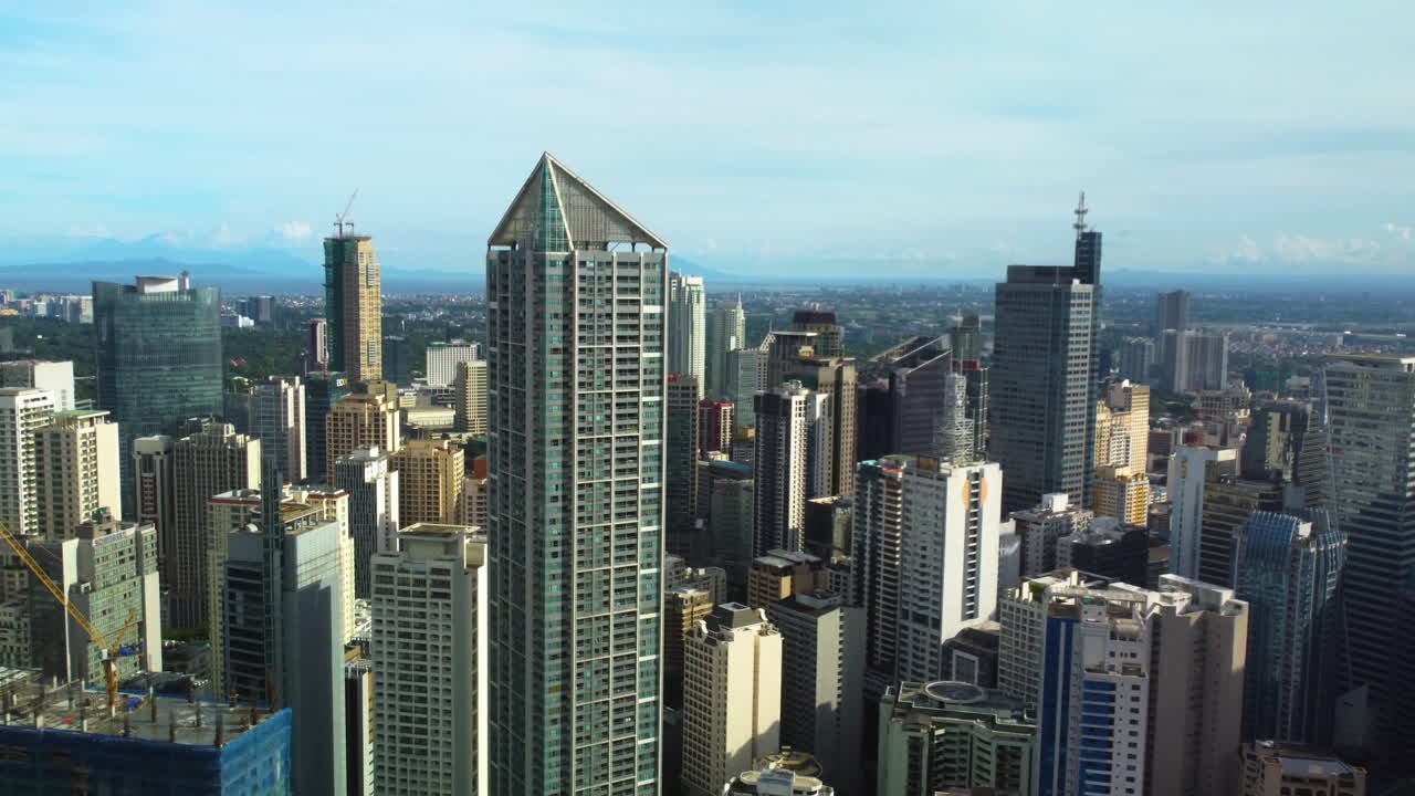 Aerial view of high-rise in the Makati business district, golden hour in Manila