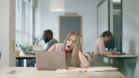 happy lady waking up after coffee at workplace. tired business woman sleeping