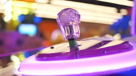 purple arcade game controller detail