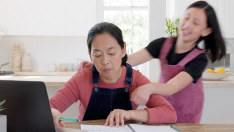 hug, child and mother working with a laptop