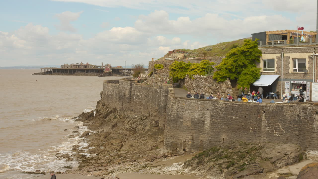 Pan shot of Birnbeck pier at Weston-super-mare in England on a sunny day. Tourist spot.