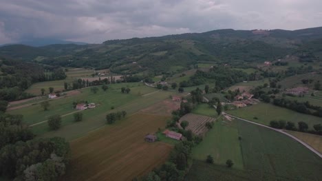 aerial drone shot flying over italian countryside in umbria, italy