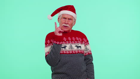 Displeased-senior-Christmas-old-man-gesturing-hands-with-displeasure,-blaming-scolding-for-failure