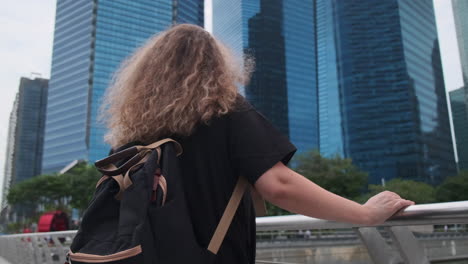 woman with backpack in singapore city