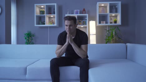 the man who is alone at home at night becomes sad.