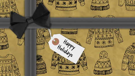 happy holidays text animation over gift-wrapped box with sweater pattern