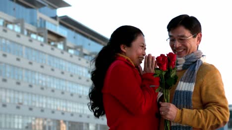 happy romantic couple with a flower