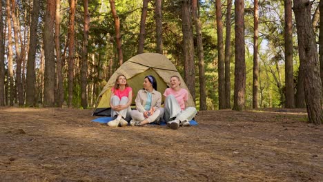three friends camping in the forest