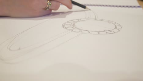 close up designing a custom wedding ring sketch 2