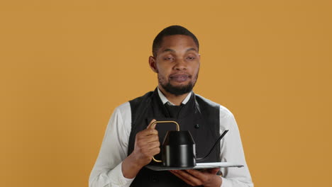 Restaurant-staff-serving-clients-with-tea-before-their-dinner-order