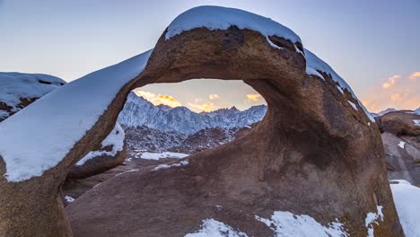 Close-Up-Of-Mobius-Arch-With-Snow-During-Sunset-In-California,-USA