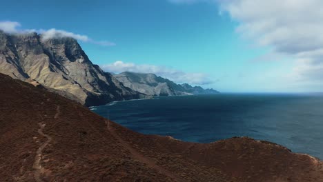 magical view of mother nature showing blue sea along huge brown rocky cliffs and mountains