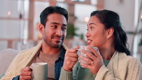 Coffee,-happy-and-couple-with-blanket-on-sofa