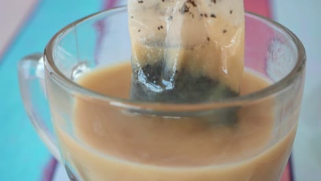 tea bag steeping in a glass cup