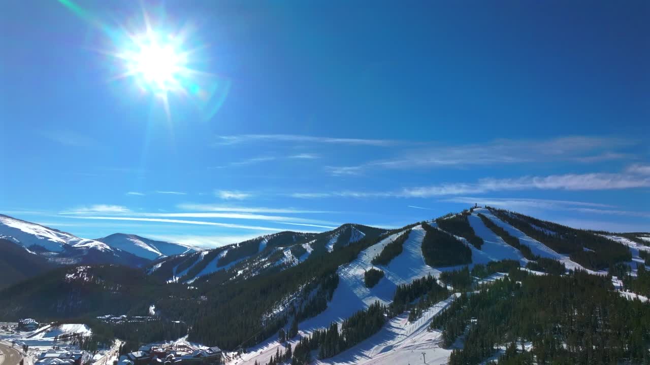 Winter Park Resort morning center village lodge ski train parking lot December blue bird sunny fresh snow Mary Jane Ski snowboard run trails Bertoud Pass Colorado gondola lifts pan up down slowly