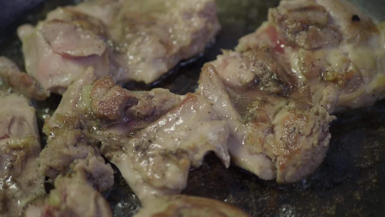 Chicken being cooked on a grill