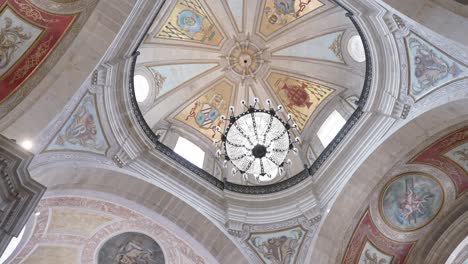 intricate painted dome with chandelier at santuário do bom jesus do monte braga portugal